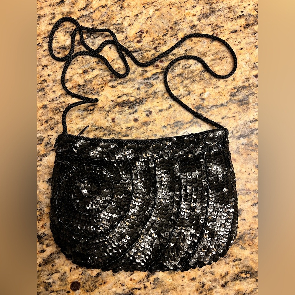 Magid handmade beaded purse black with zip top, rope strap and silky lining.